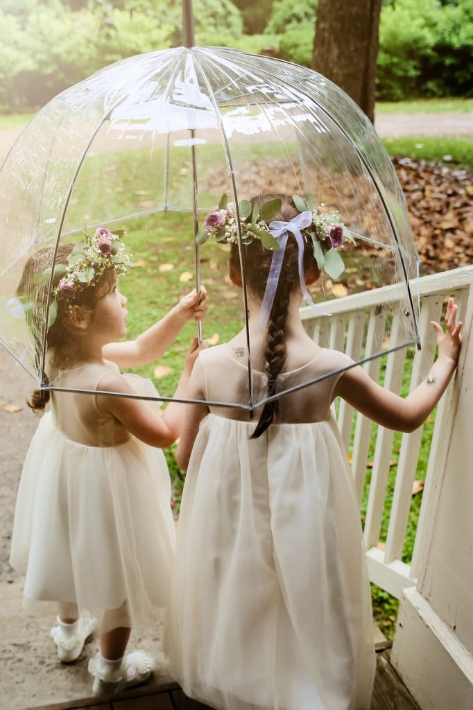 flower girls under umbrella