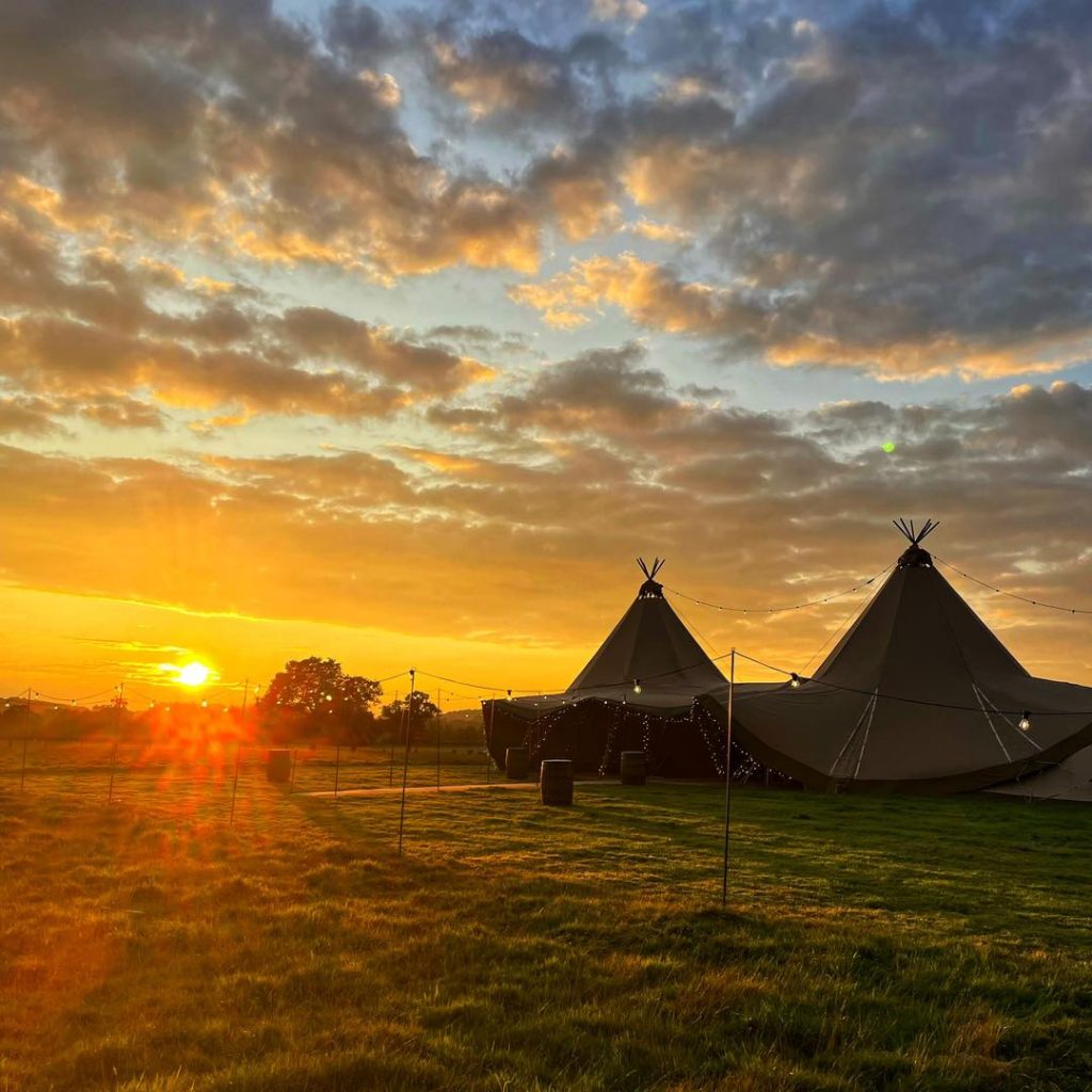 Watching the sunset over the wedding tipi at The Venue at Gayton