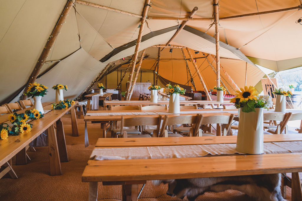 Long tables inside our wedding tipi